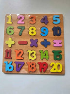 Colorful number and symbol puzzle on a wooden board
