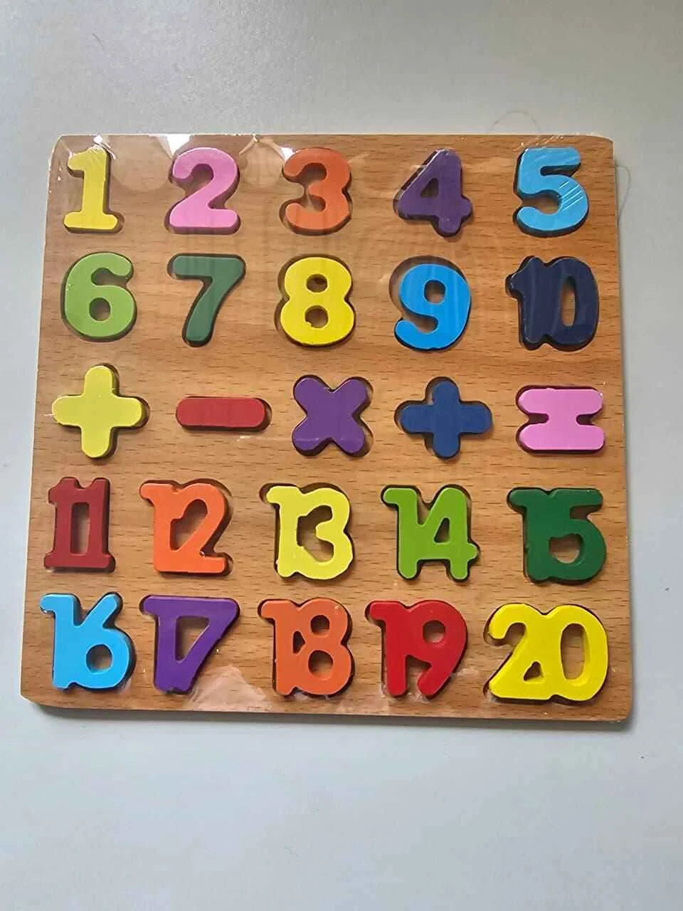 Colorful number and symbol puzzle on a wooden board
