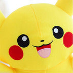 Close-up of a yellow plush toy with black eyes and red cheeks