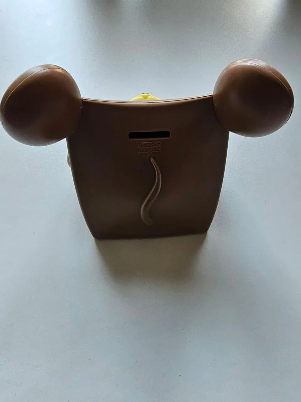 Brown container with ears on a light gray background