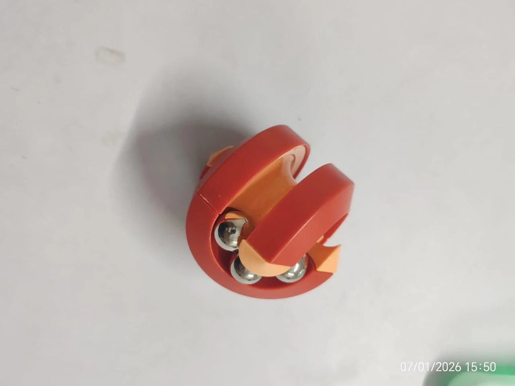 Red and orange mechanical component on a light gray background