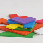 Colorful foam puzzle pieces on a white background