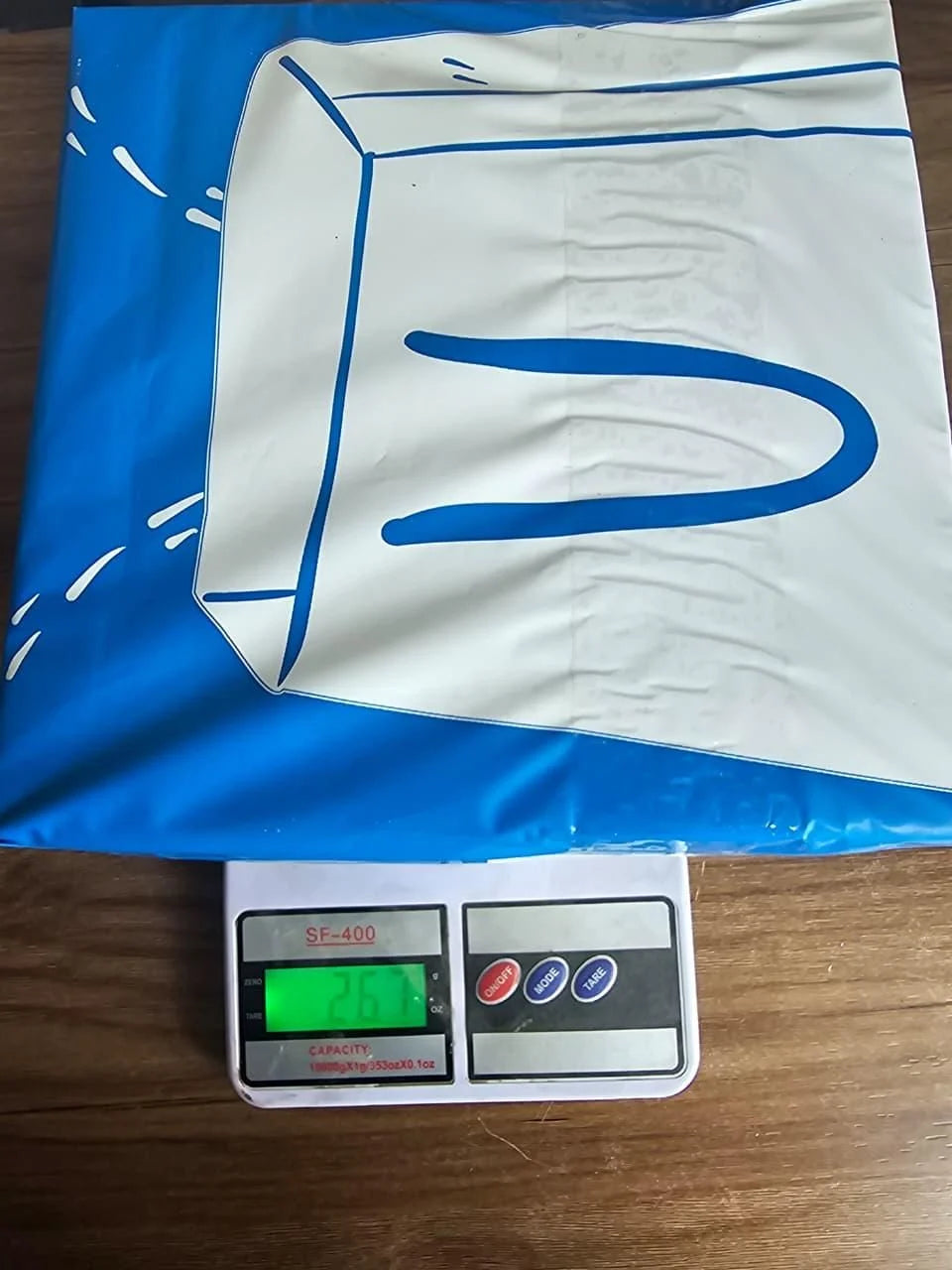 White fabric with blue markings on a digital scale
