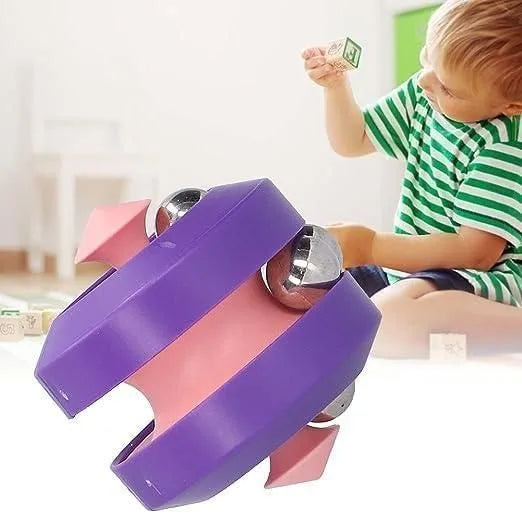 Child playing with a colorful toy structure indoors