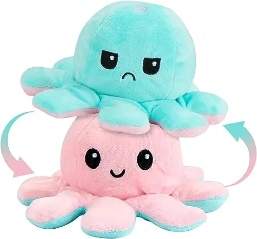 Plush toy with a two-tone design, transitioning from pink to blue, on a white background.