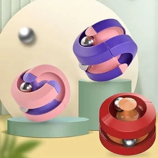 Colorful puzzle toy with metallic balls on a pastel background