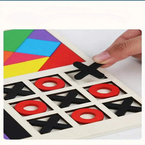 Colorful geometric shapes on a board with a hand placing an 'X' piece.